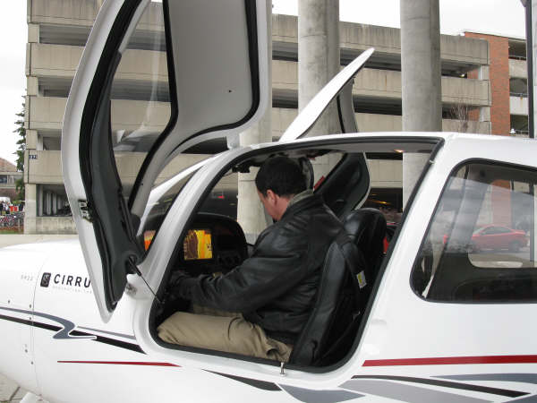 Yuri Kovchegov sitting in the cockpit of a plane