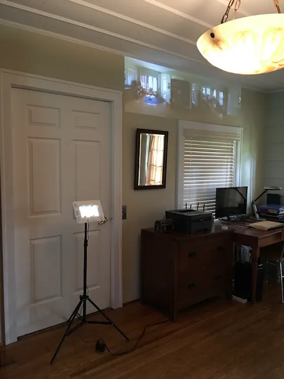 viewer on stand and projection on wall