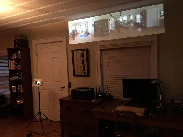 viewer on stand and projection on wall